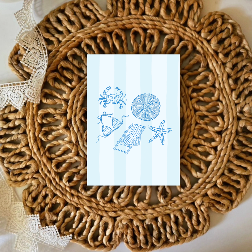 Rattan placemat with a decorative card featuring beach-themed illustrations on a white background.