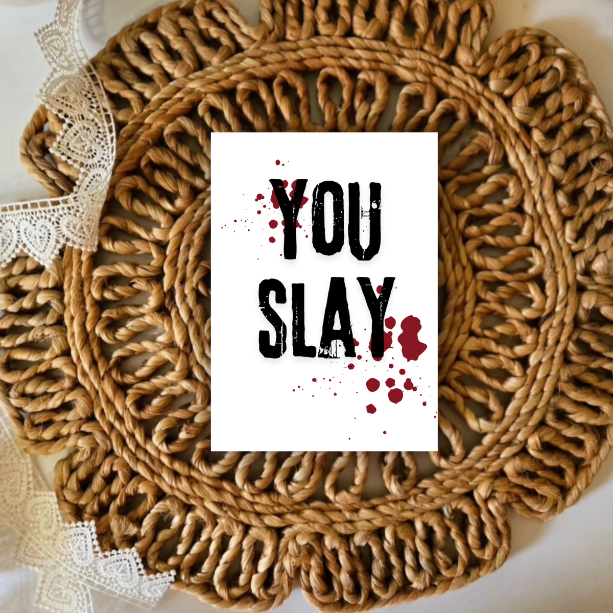 Round woven mat with 'YOU SLAY' text card on a white background