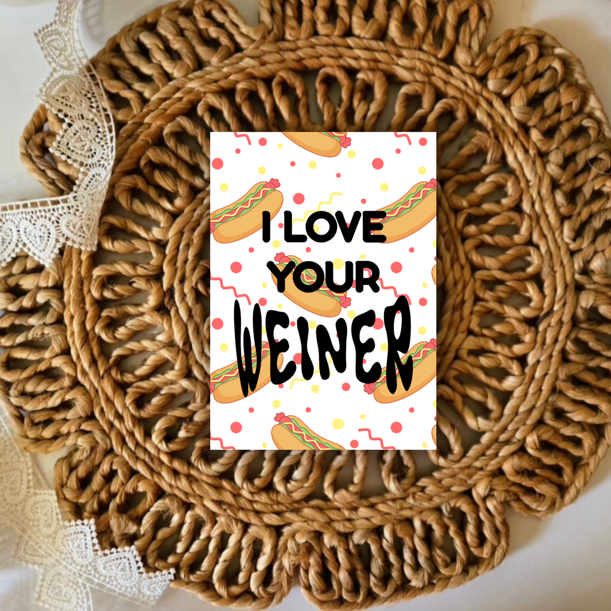 Card with 'I Love Your Weiner' text on a woven mat