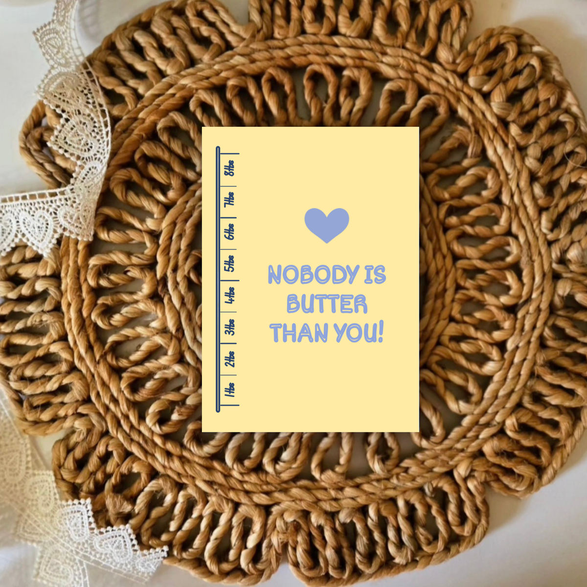 Woven placemat with a card reading 'Nobody is butter than you!' on a white background