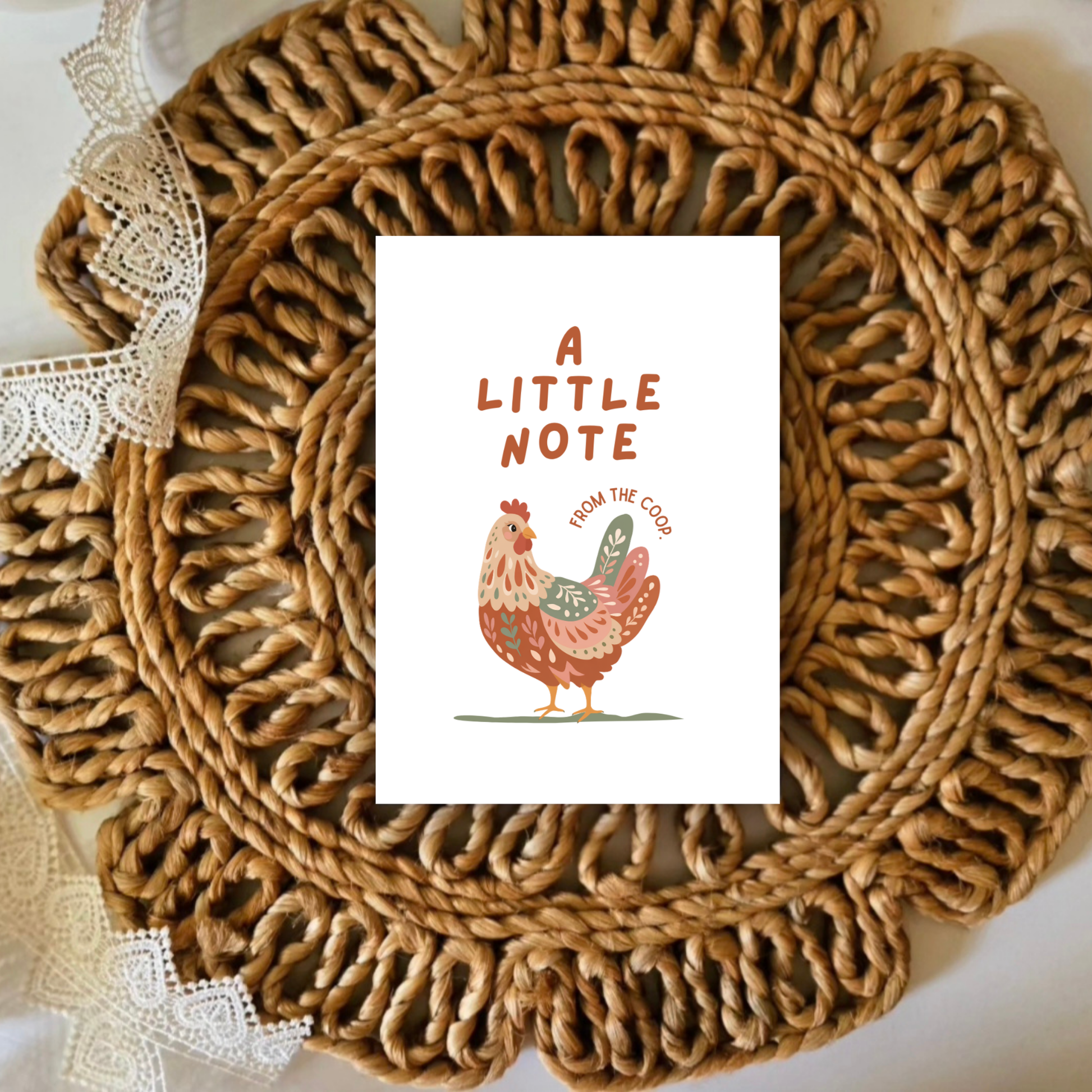 Woven placemat with a card featuring a rooster illustration and text on a white background