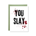 Greeting card with 'YOU SLAY' text and red splashes on a white background