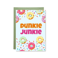 Greeting card with colorful donut pattern and 'Dunkie Junkie' text on a white background